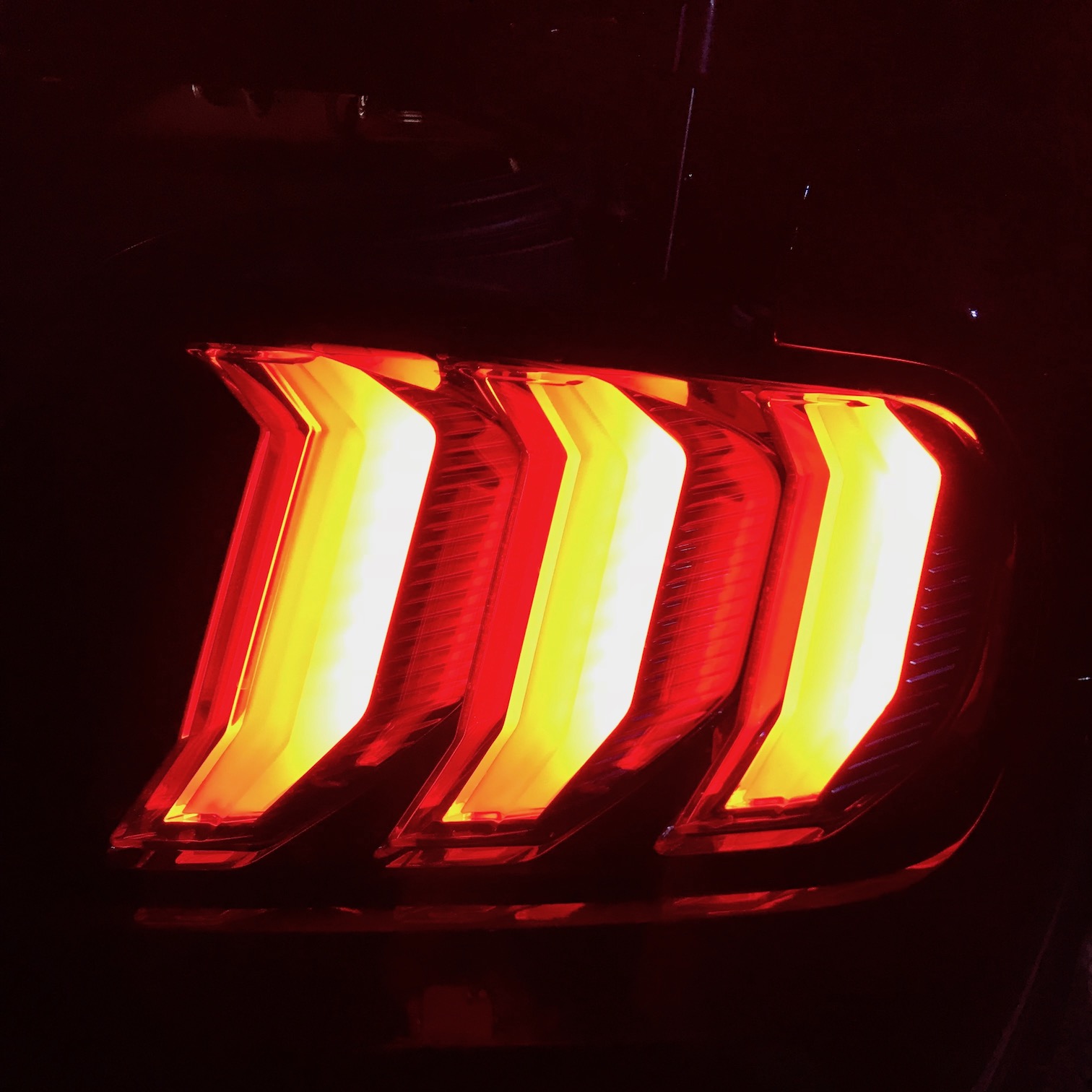 Brake lights on the Mustang.
